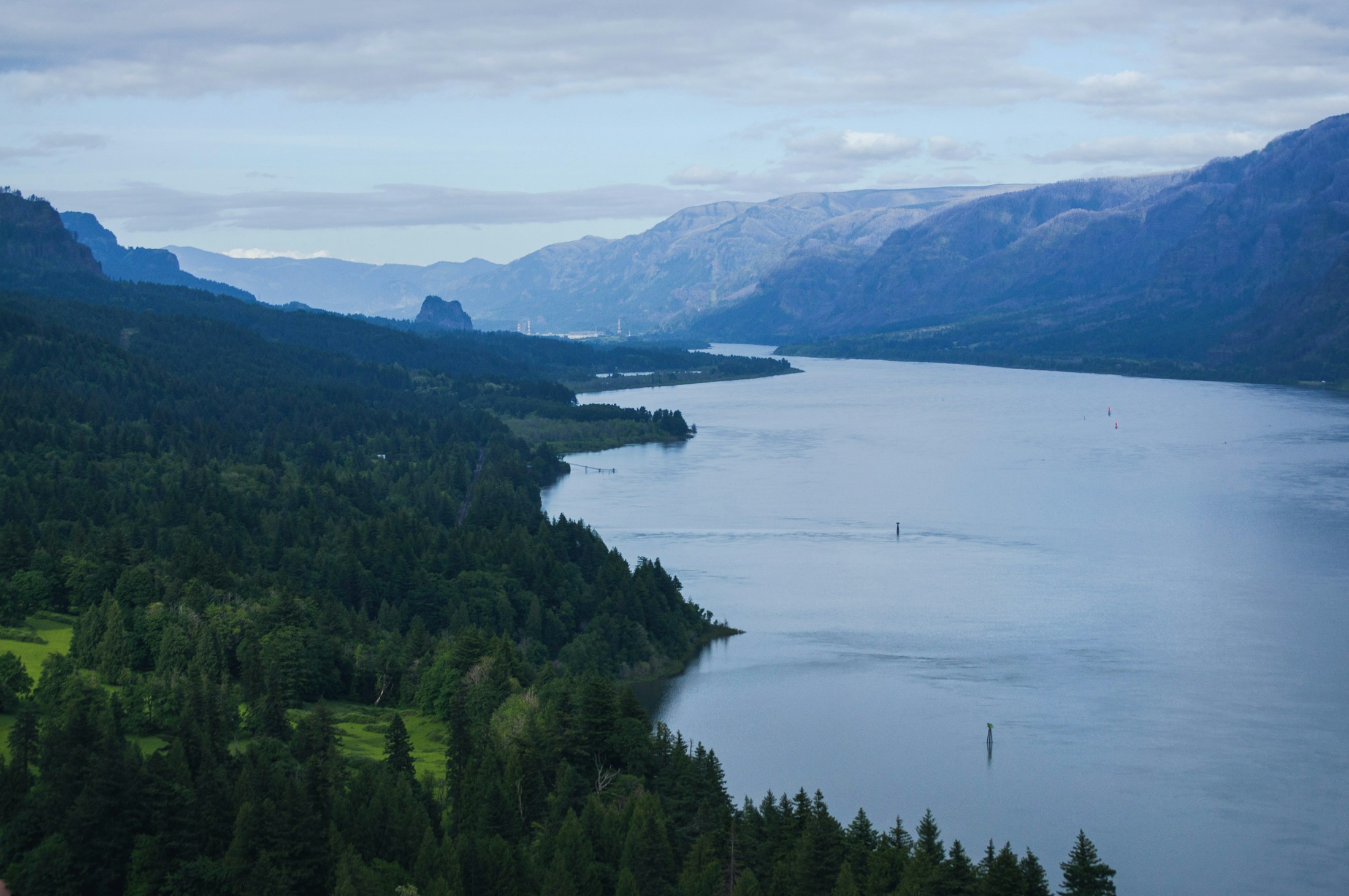 Columbia River winding between forested Pacific Northwest hills